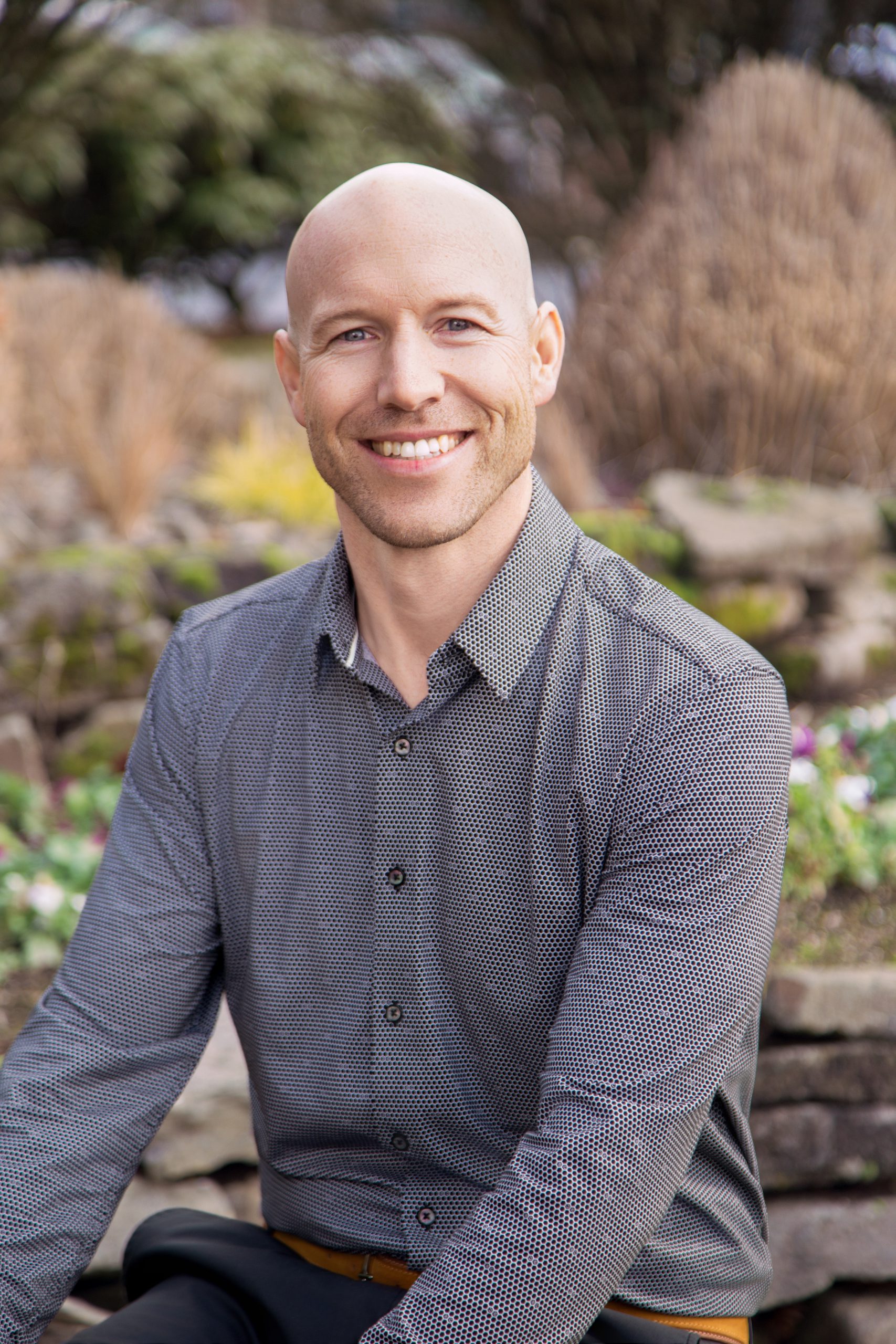 An image of Dr. Chris James DMD wearing a printed shirt.